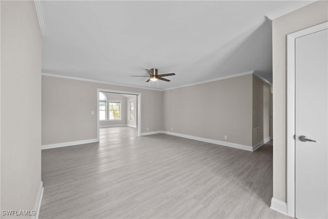 unfurnished room with light hardwood / wood-style floors, ornamental molding, and ceiling fan