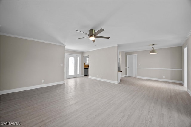 unfurnished living room with ceiling fan, ornamental molding, and light hardwood / wood-style flooring