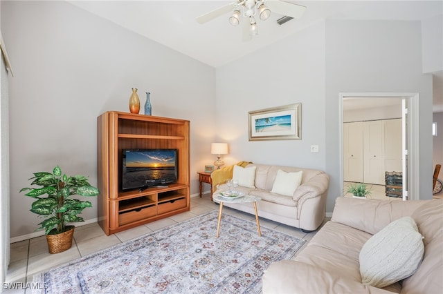 living room featuring light tile patterned flooring, high vaulted ceiling, and ceiling fan