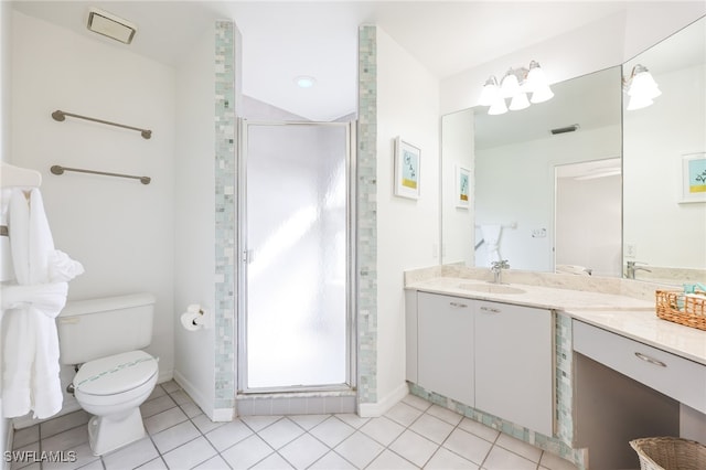 bathroom with toilet, vanity, tile patterned floors, and a shower with door