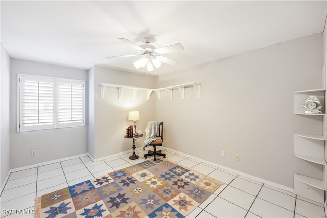 unfurnished room featuring ceiling fan and light tile patterned floors