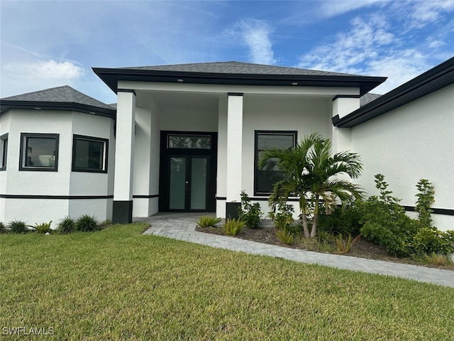 property entrance with a yard