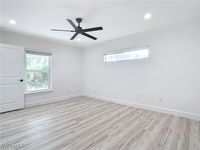 empty room with light hardwood / wood-style flooring and ceiling fan