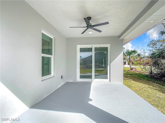 view of patio / terrace featuring ceiling fan