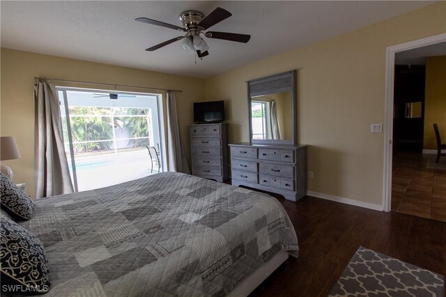 bedroom featuring dark wood-type flooring, multiple windows, access to outside, and ceiling fan