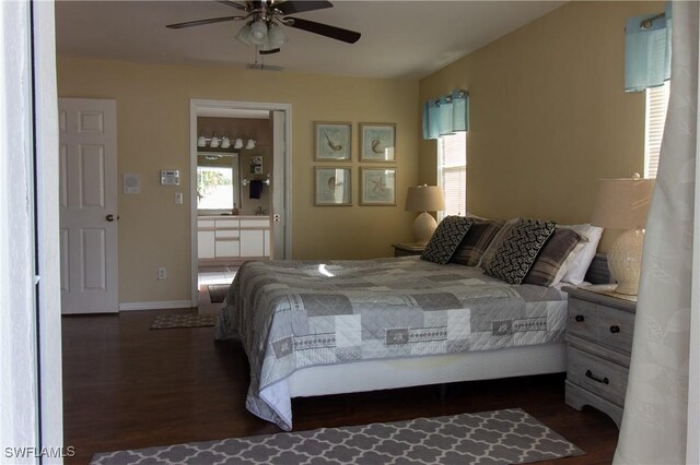 bedroom featuring multiple windows, dark hardwood / wood-style floors, ensuite bathroom, and ceiling fan