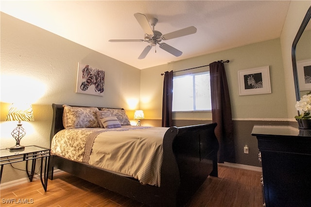 bedroom featuring hardwood / wood-style flooring and ceiling fan