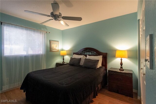 bedroom featuring hardwood / wood-style flooring and ceiling fan