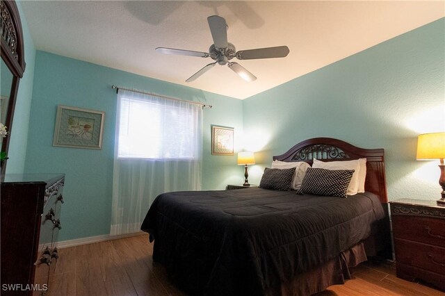 bedroom featuring ceiling fan and light hardwood / wood-style flooring