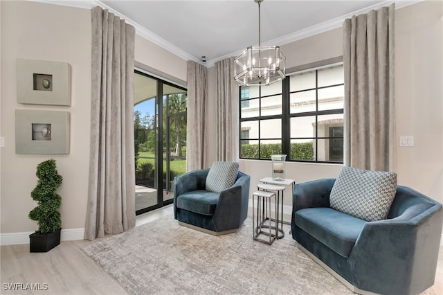 living area with crown molding, a chandelier, and wood-type flooring