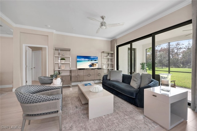 living room with crown molding, light hardwood / wood-style floors, and ceiling fan