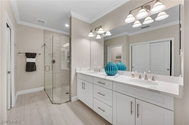 bathroom featuring vanity, crown molding, and an enclosed shower