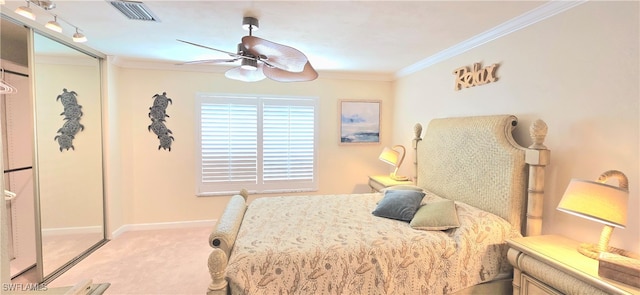 bedroom with light carpet, ceiling fan, and crown molding