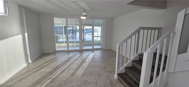 interior space with ceiling fan