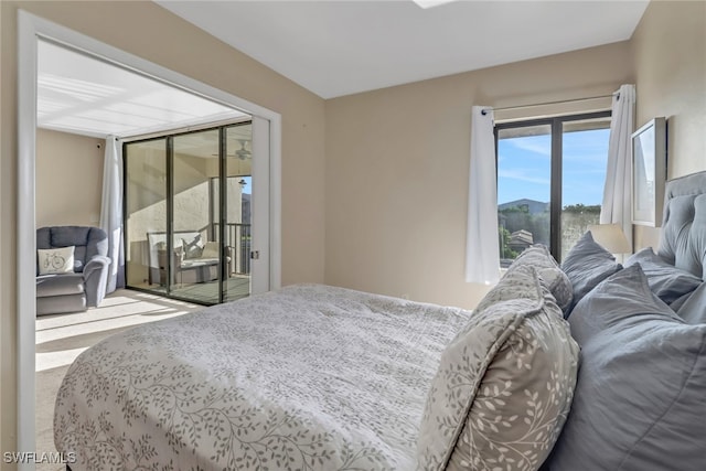 carpeted bedroom with access to exterior