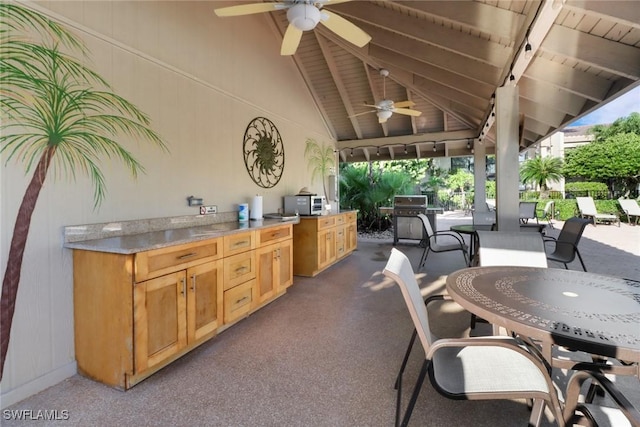 view of patio with ceiling fan, outdoor dining area, and area for grilling