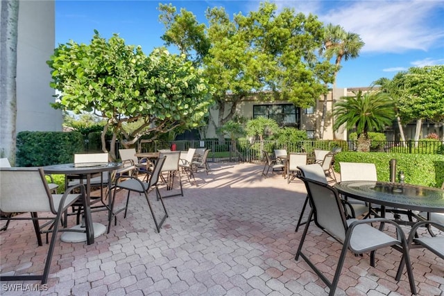 view of patio / terrace with outdoor dining space and fence