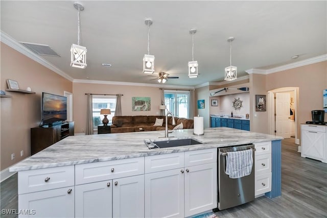 kitchen with pendant lighting, white cabinetry, ceiling fan, and sink