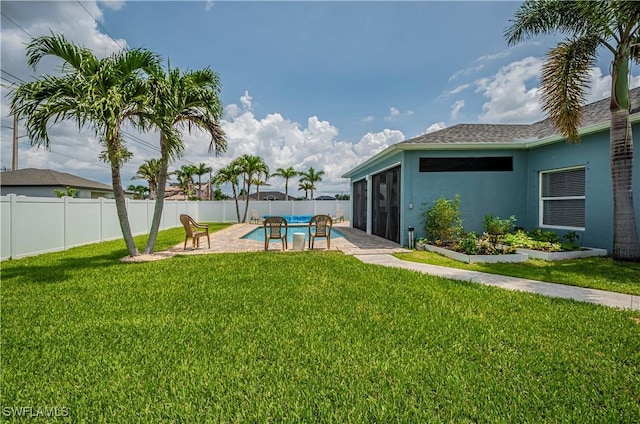 view of yard featuring a patio area and a sunroom