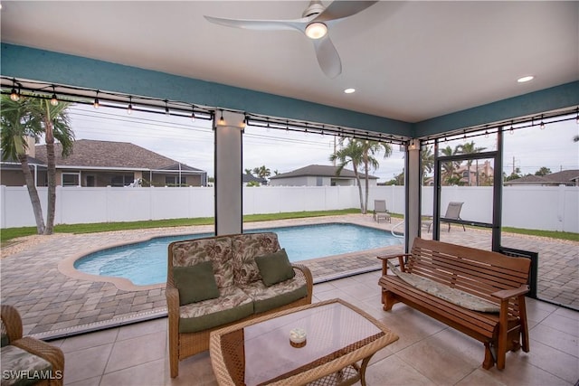 view of swimming pool featuring ceiling fan