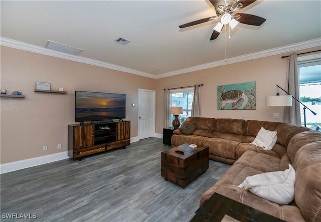 living room featuring crown molding, ceiling fan, and dark wood-type flooring