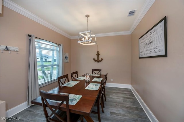 dining space featuring a chandelier, dark hardwood / wood-style flooring, and crown molding