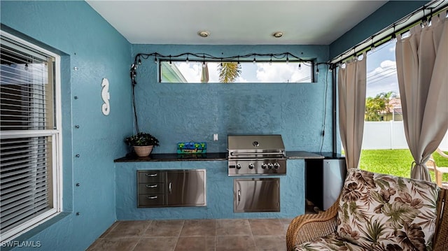 view of patio with a grill and an outdoor kitchen