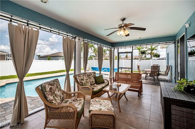 sunroom / solarium with ceiling fan