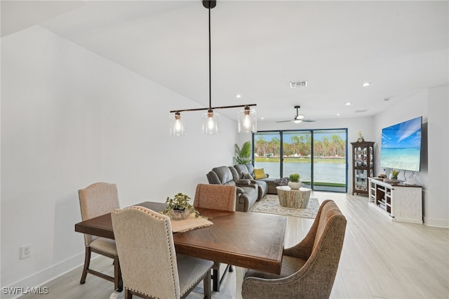 dining space featuring light hardwood / wood-style floors and ceiling fan