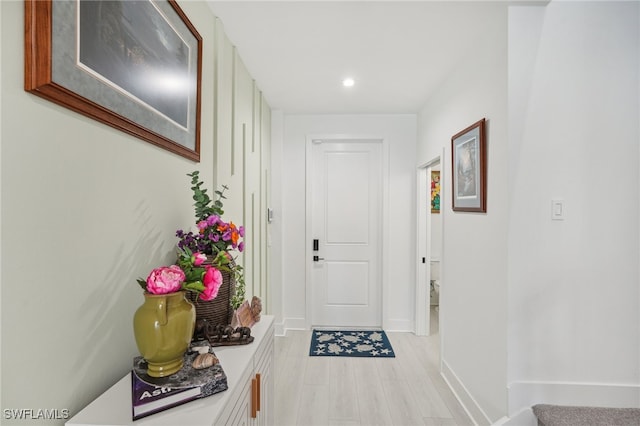 hallway with light hardwood / wood-style flooring