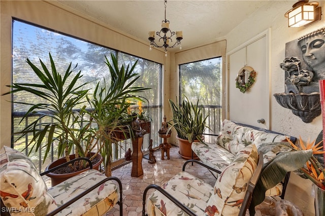 sunroom with a notable chandelier