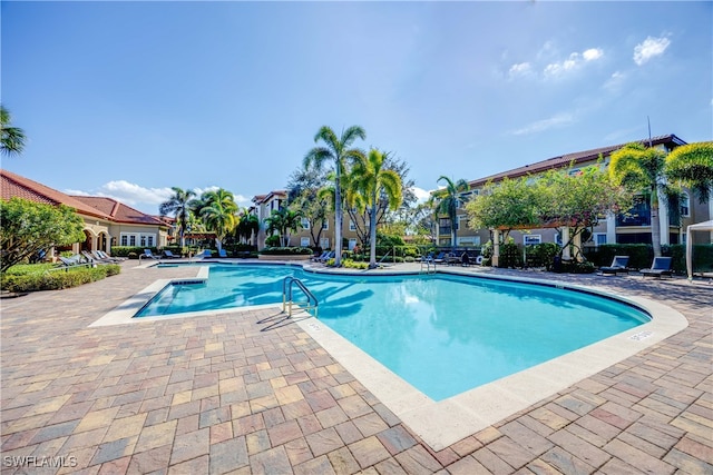 view of swimming pool with a patio