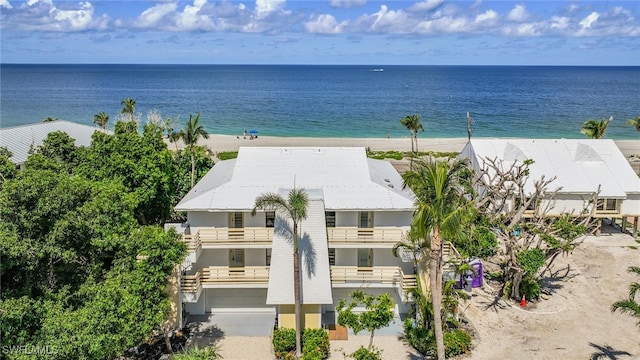 aerial view featuring a water view and a beach view