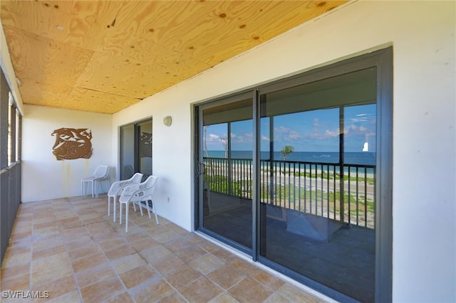 balcony featuring a water view