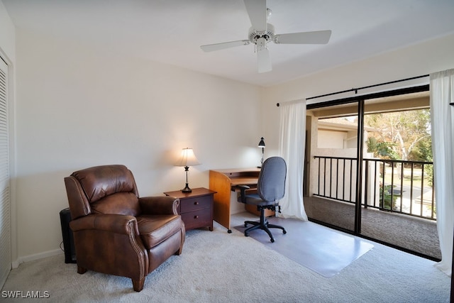 carpeted office featuring ceiling fan