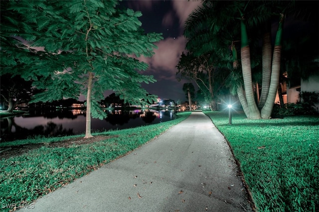 surrounding community featuring a water view