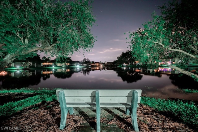 surrounding community featuring a water view