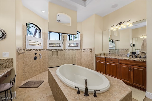 bathroom featuring vanity, tile patterned flooring, and plus walk in shower