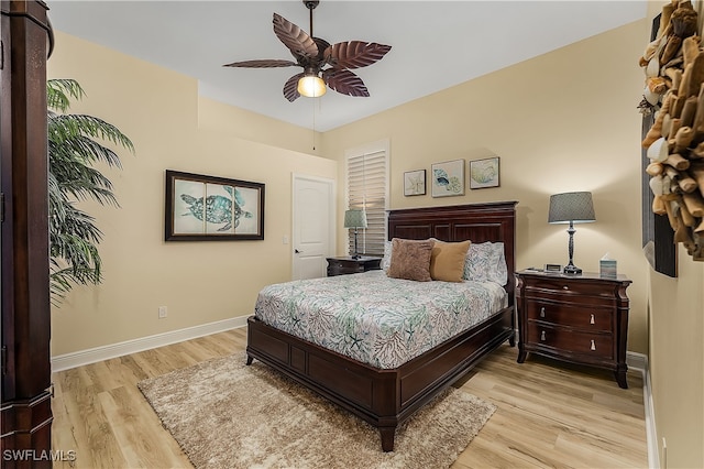 bedroom with light hardwood / wood-style flooring and ceiling fan