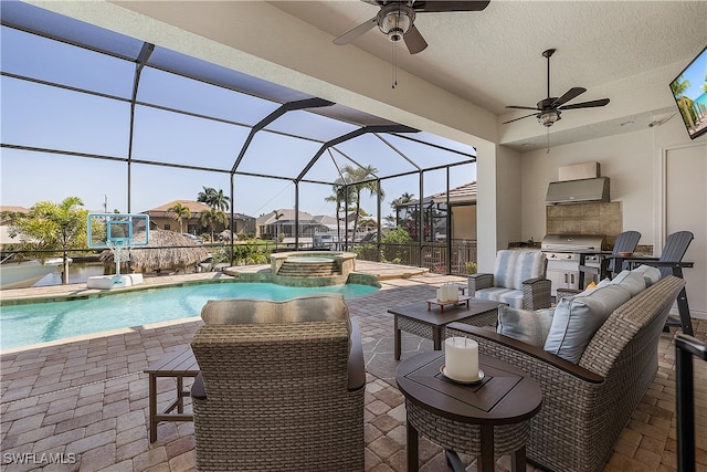 view of pool with a patio area, area for grilling, a lanai, and an in ground hot tub