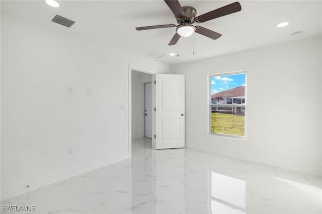 spare room with ceiling fan