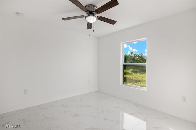 spare room with ceiling fan