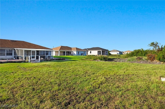 view of yard with a sunroom