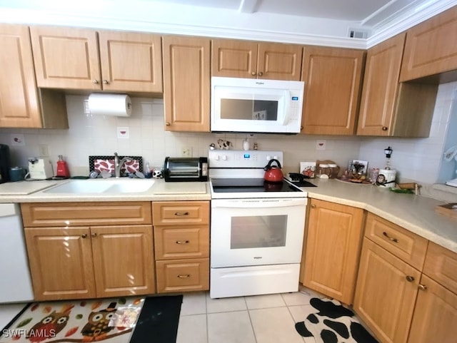 kitchen with white appliances, sink, decorative backsplash, light tile patterned floors, and ornamental molding