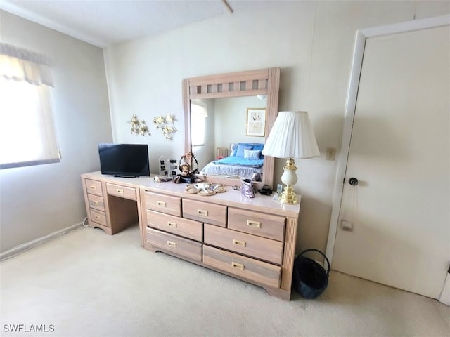 bedroom with light colored carpet