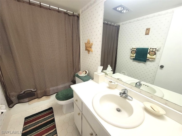 bathroom featuring toilet, vanity, tile patterned floors, and a shower with shower curtain