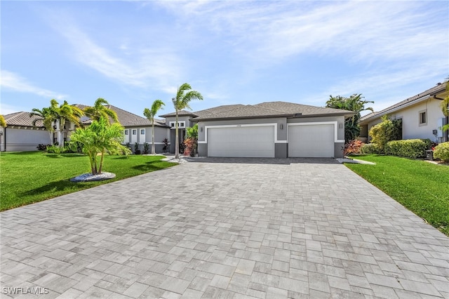 view of front of home featuring a front lawn and a garage