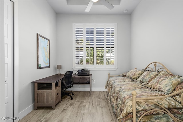 bedroom with light wood-type flooring and ceiling fan