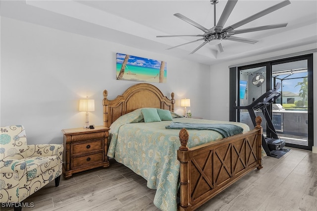 bedroom with hardwood / wood-style floors and ceiling fan