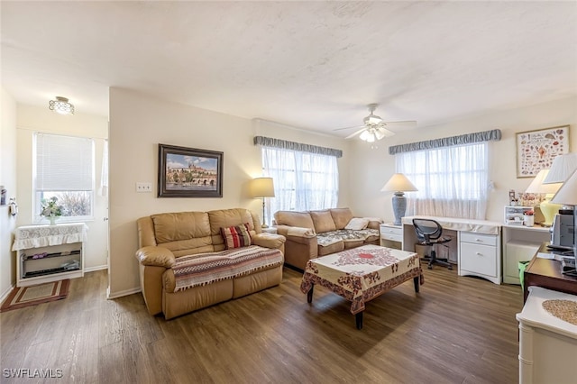 living room featuring dark hardwood / wood-style flooring, ceiling fan, and plenty of natural light